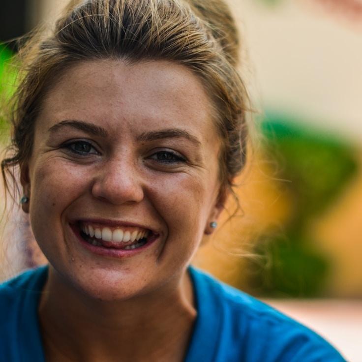 Kaveri Mehta, Lead Design Curator at CrestLunarHarbor, reviewing corporate floral arrangements